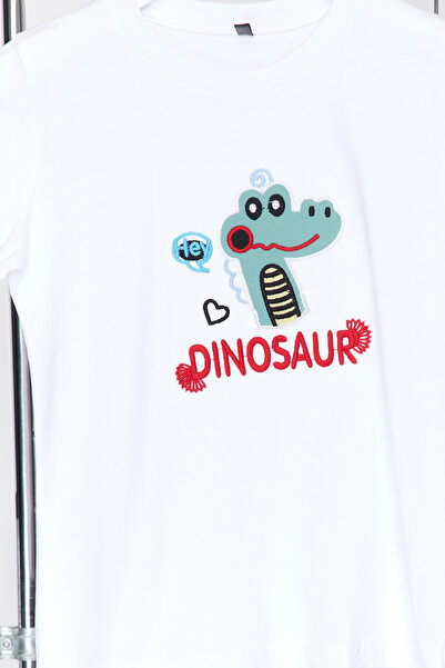 TRENDYOLKIDS Weißes Jungen-T-Shirt aus Baumwolle mit Dinosauriermuster TKDSS24TS00030