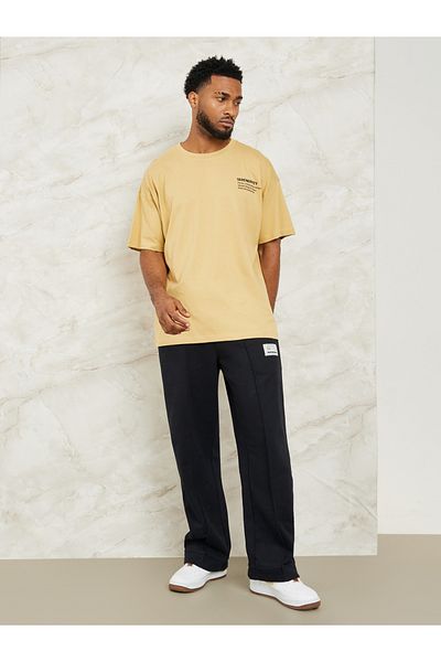 Styli Fleece Pintuck Wide Leg Jogger with Badge Detail