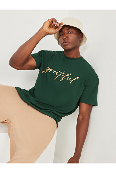 Styli تي شيرت بطباعة نص على الصدر مقاس كبير