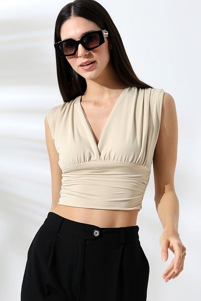DWOZ Cream Crop Knitted Blouse - Deep V-Neck, Sandy Model