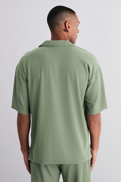 Trendyol Collection Limitierte Auflage - Mintfarbenes, weit geschnittenes, strukturiertes und knitterfreies Ottoman-Polo-T-Shirt TMNSS23PO00020
