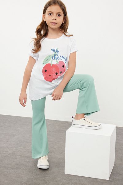 TRENDYOLKIDS Λευκό κορίτσι με μοτίβο φρούτων βαμβακερό πλεκτό μπλουζάκι TKDSS24TS00042