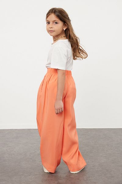 TRENDYOLKIDS Oranžové dámské dětské tkané kalhoty se širokými nohavicemi TKDSS24PL00008
