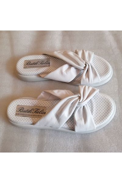 Butik Tülin شبشب نسائي من الجلد الطبيعي باللون الأبيض مع شريط فيونكة ووسادة جلدية ناعمة تشريحية ونعل مسطح غير قابل للانزلاق