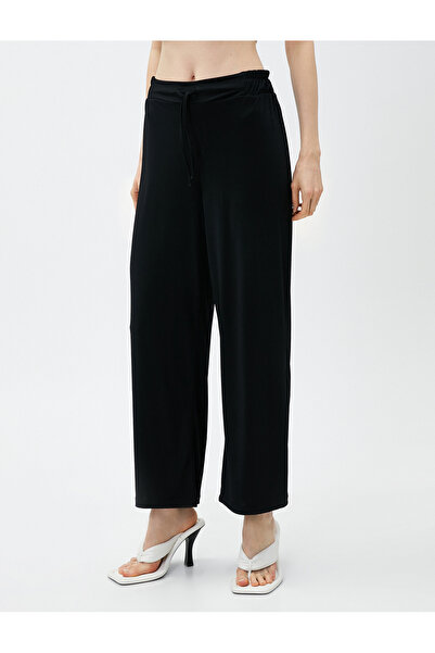 Koton Široké kalhoty s kravatou v pase