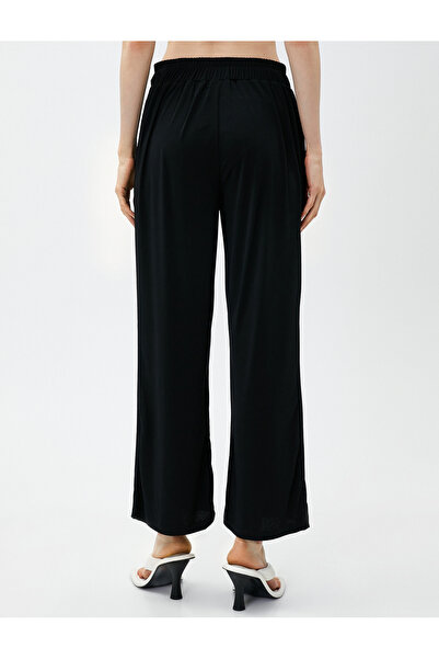 Koton Široké kalhoty s kravatou v pase