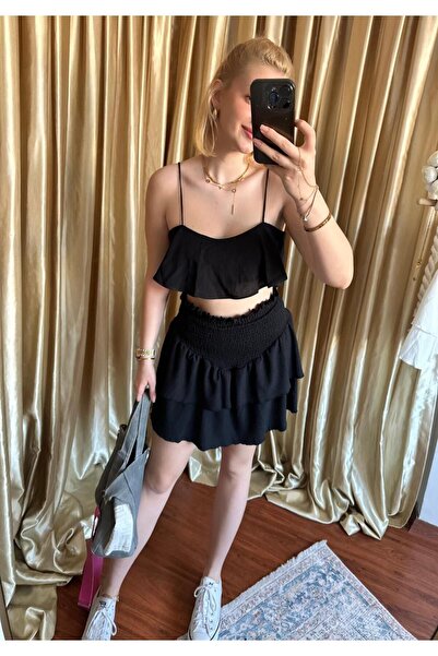 FİOXCO تنورة قصيرة سوداء مكشكشة من Mykonos - La Sarta