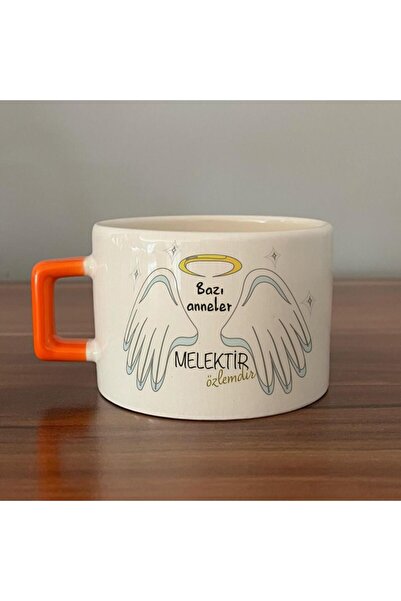Kırtasiye Ofisi كوب C ذو مقبض برتقالي مطبوع عليه عبارة "بعض الأمهات هم ملائكة