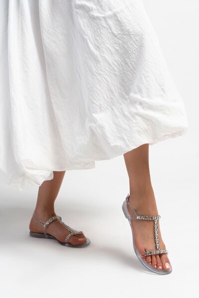 NİŞANTAŞI SHOES فيينا - صندل نسائي ذو نعل مسطح وربطة عنق من الحجر الشفاف