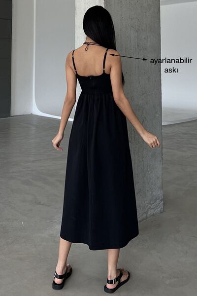 Domoda Μαύρο φόρεμα με σχιστό λουράκι @emilia με φερμουάρ επάνω κορδόνι και υφαντό φλουντ στο κάτω μέρος