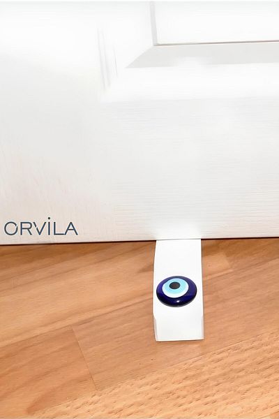Orvila Λευκό Evil Eye Bead κάτω από το πώμα στοπ της πόρτας