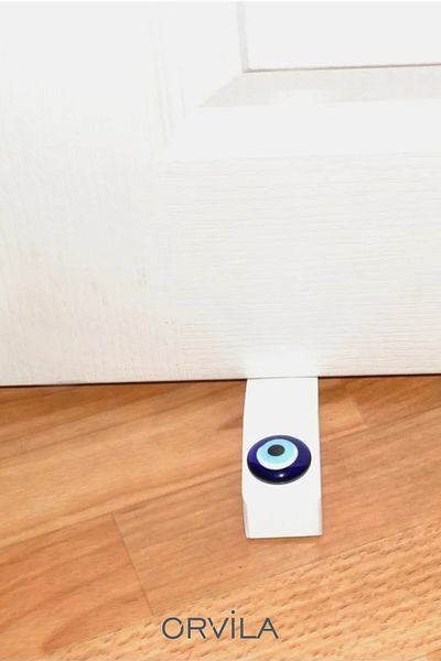 Orvila Λευκό Evil Eye Bead κάτω από το πώμα στοπ της πόρτας