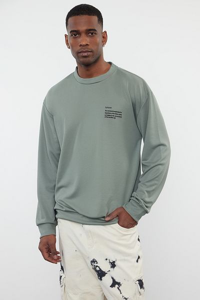 Trendyol Collection Mintfarbenes, weit geschnittenes Sweatshirt mit Rundhalsausschnitt – Minimal Textdruck TMNAW23SW00237