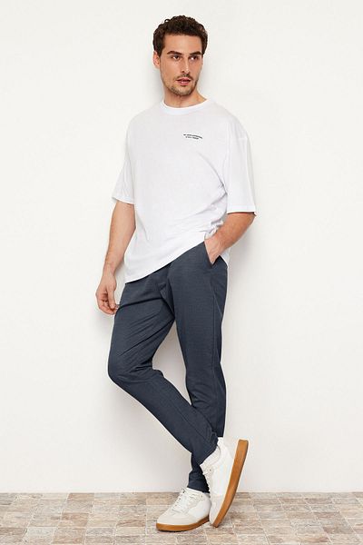 Trendyol Collection Sötétkék Jogger Fit elasztikus derékkötő texturált kötött kényelmes nadrág TMNSS24PL00007