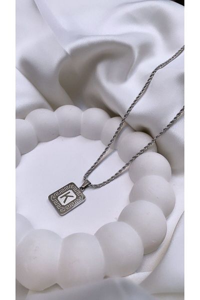 Accessories قلادة فضية بحرف فولاذي حرف K
