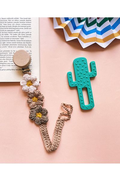 The Cloudish Shop hand-knitted baby flower pacifier strap with pacifier chain flower detail