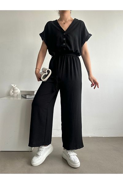 BEJNA Schwarzer Jumpsuit mit Gürtel für Damen – Knopfdetail