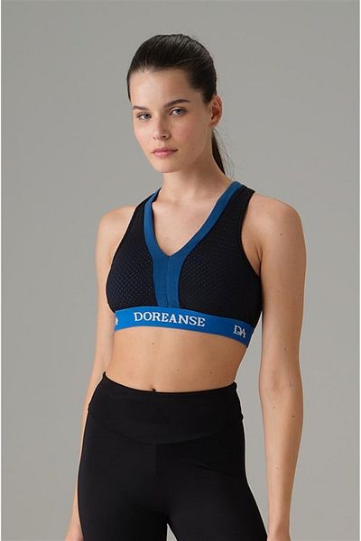 Doreanse Sutien sport cu ochiuri din cauciuc cu cruce albastră pentru femei 5586