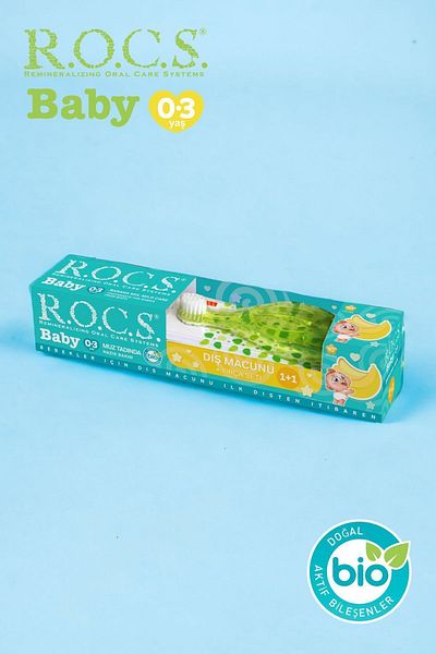 R.O.C.S. معجون أسنان روكس بيبي 0-3 سنوات بطعم الموز الهريس 45 جم + مجموعة فرشاة أسنان باللون الأخضر