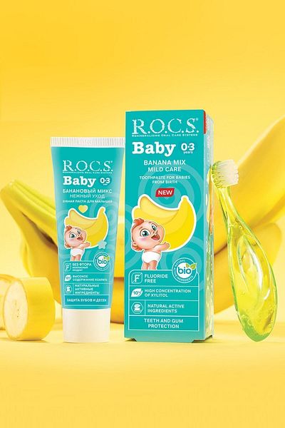 R.O.C.S. معجون أسنان روكس بيبي 0-3 سنوات بطعم الموز الهريس 45 جم + مجموعة فرشاة أسنان باللون الأخضر