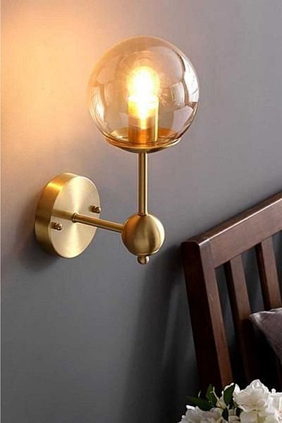 BSA LIGHTING Ada Single Antique Sconce with Honey Glass