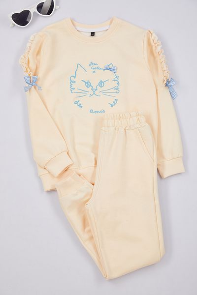 TRENDYOLKIDS Beiges Pyjama-Set für Mädchen mit Katzenmuster - Strickset Tkdaw25au00077
