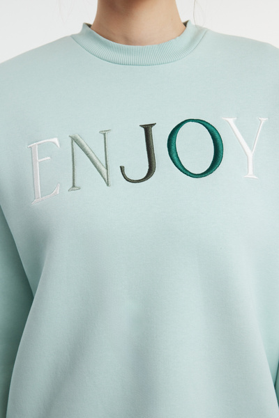 Trendyol Collection Mint Slogan Vyšívací detail Oversize/široký výstřih Pletená mikina TWOAW25SW00127