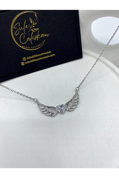 ŞULE ÇALIŞKAN BUTİK VE KUYUMCULUK Kanatlı kalp çelik kolye silver