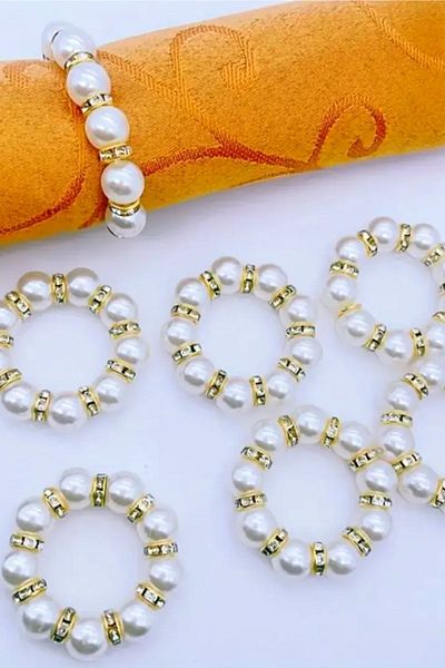 Nildenhobim Stylish Ecru Napkin - Gold Colored and Pearl Ring, 6 Rings