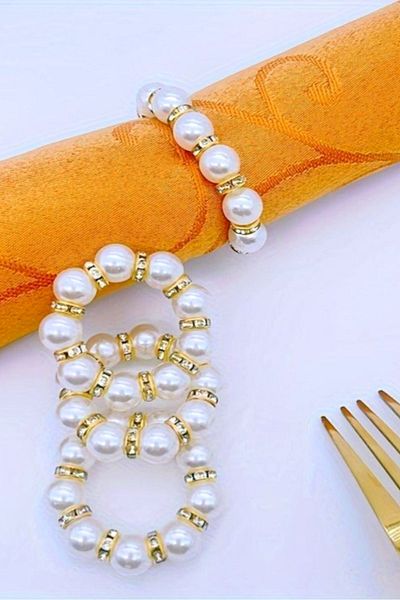 Nildenhobim Stylish Ecru Napkin - Gold Colored and Pearl Ring, 6 Rings