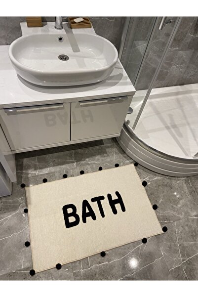 RUGSMODERN Банний килимок з чорним помпоном і написом 90×57