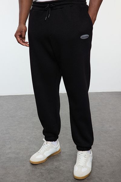 Trendyol Collection Черен голям спортен панталон с джоб с голям размер - TMNAW25AJ00001