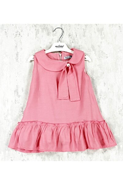 Carino Pudra renkli kız çoçuk elbise. Fiyonk detaylı, alt kısmı fırfırlı