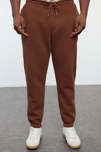 Trendyol Collection Καφέ συν μέγεθος κανονικής/κανονικής κοπής λαστιχένιο παντελόνι Jogger Fleece TMNAW24AJ00002