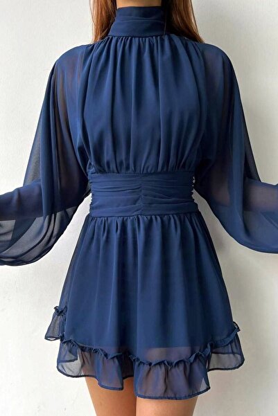 CoolLook Dik Yaka Uzun Lastikli Kol Fermuarlı Sırt Dekolteli Etek Ucu Fırfırl...