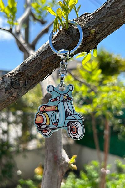 CoNotes Light Blue Keychain with Motorcycle Design
