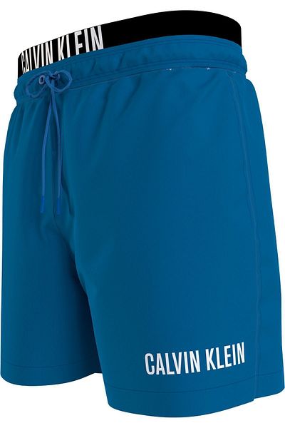Calvin Klein Erkek Marka Logolu Çabuk Kuruyan Polysterli  Plaj Ve Deniz Kullanıma Uygun Mavi Deniz Şortu KM0KM009