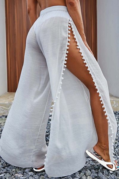 Angelsin Strandhose - Pareo mit Pompom und Schlitzdetail