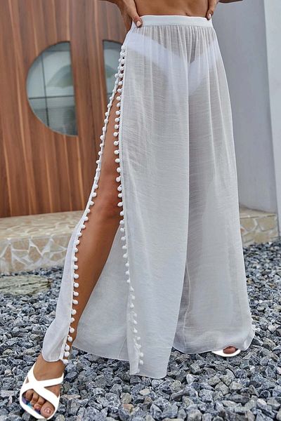 Angelsin Strandhose - Pareo mit Pompom und Schlitzdetail
