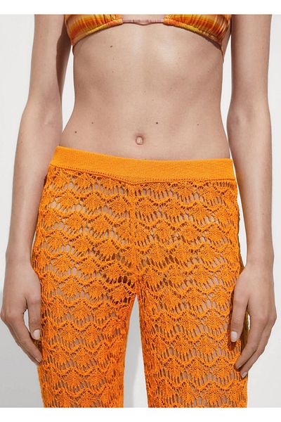 MANGO Woman Pantaloni evazați din croșetat