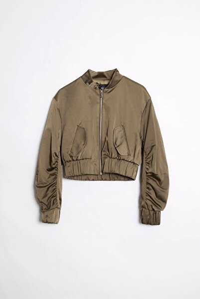 ORJEEN KADIN PARAŞÜT KUMAŞ BELİ VE KOLU LASTİKLİ ÖNÜ FERMUAR KAPAMALI DÜZ REN...