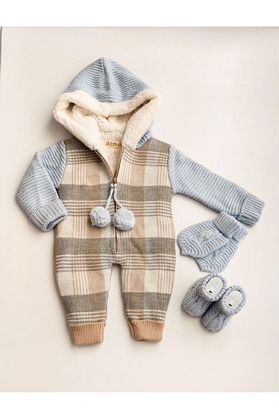 a baby Merino Lined Lamb Pompom Jumpsuit