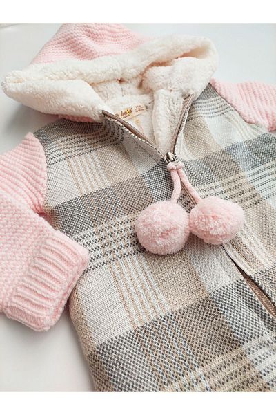 a baby Merino Lined Lamb Pompom Jumpsuit