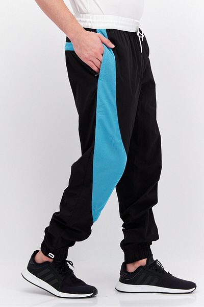 Puma Men Brand Logo Outdoor Track Pant, Black Combo