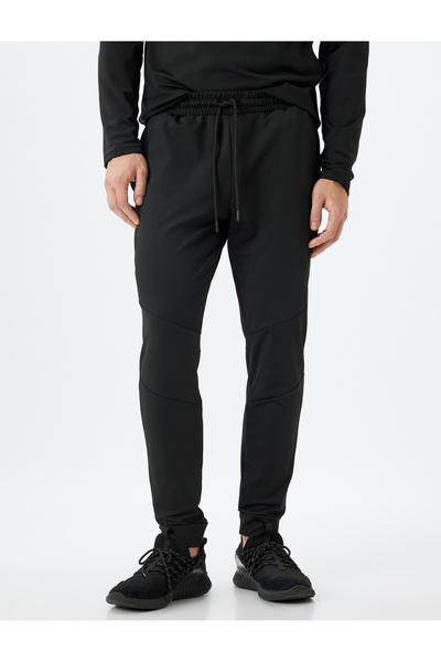 Koton Sportliche Jogginghose mit Schnürung und Taschendetail an der Taille