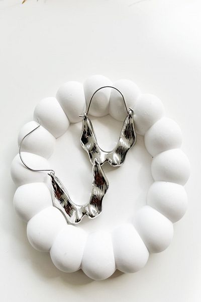 Pretty Asymmetric Cut Steel Hoop Earrings