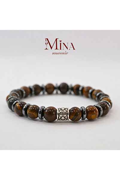 Mina Souvenir عين النمر (الطاقة، الشجاعة، الذهن) وسوار حجر الهيماتيت (التوازن).