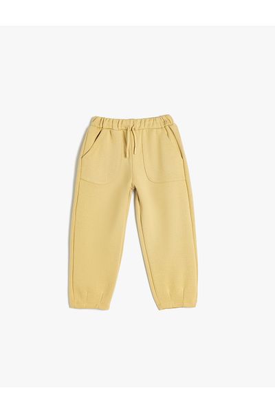 Koton Basic Jogger-Jogginghose mit Bindegürtel und Taschendetail aus Baumwolle