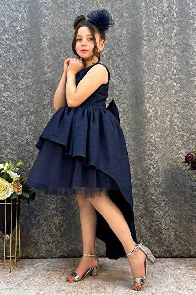 Riccotarz Βραδινό φόρεμα για κορίτσι σε μπλε ναυτικό με κοντή λεπτομέρεια από τούλι μπροστά και μακριά λεπτομέρεια από κορδέλα στο πίσω μέρος, ηλικία 6-9 ετών