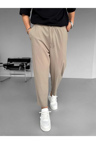 ablukaonline Beige Men's Slim Fit Carrot Cut Parachute Fabric Elastic Trousers